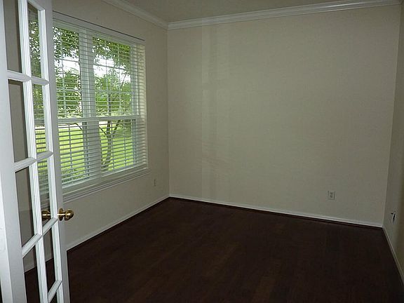 Study with double French door entry to the left of the entry hall