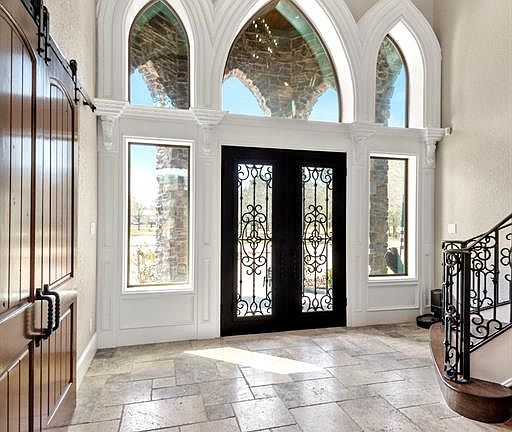 Once you get inside you will be amazed at the detail in this Custom built home. The Travertine flooring strictly inviting together with the Custom Low Heat Cased Window Design.