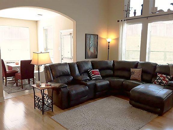 Soaring ceilings and arched doorways add to the architectural beauty of the space.