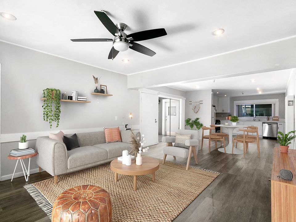Living Room looking into kitchen and dining area