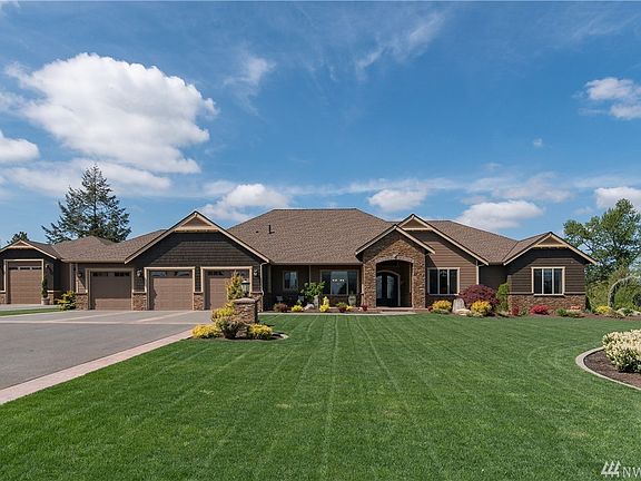 This exquisite rambler, detached RV garage/shop and property is a vision of perfection. 