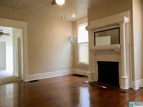 Living room with hardwood floors and fireplace
