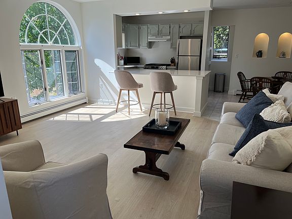 Large 3 seater couch and club chair add to the comfortable spacious room.