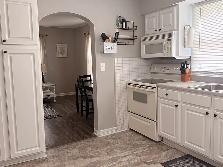 Large Kitchen. Dishes, Glassware, Pots and Pans, Crockpot, Coffee Maker, Microwave, Full Size Refrigerator.