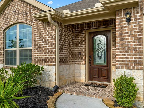 The leaded glass door and porch welcome you to this beautiful home. Wait til you see how amazing the inside is.