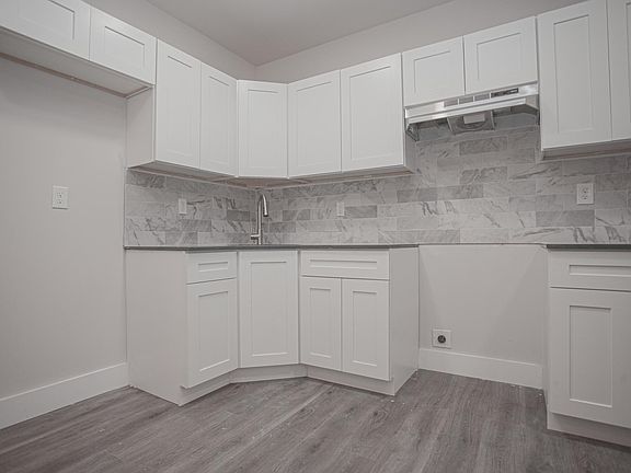 Kitchen includes a stove and fridge