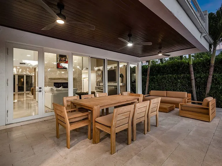 Enjoy alfresco dining surrounded by lush landscaping for a relaxed outdoor experience.