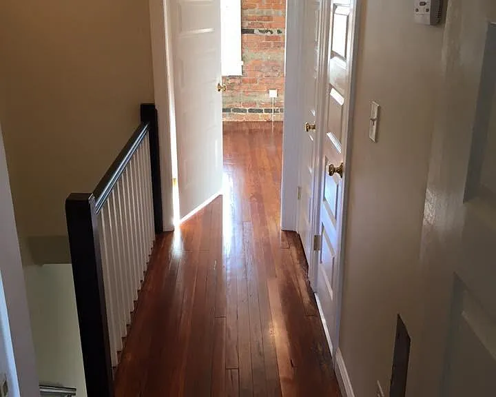 View to front bedroom from upstairs hall.