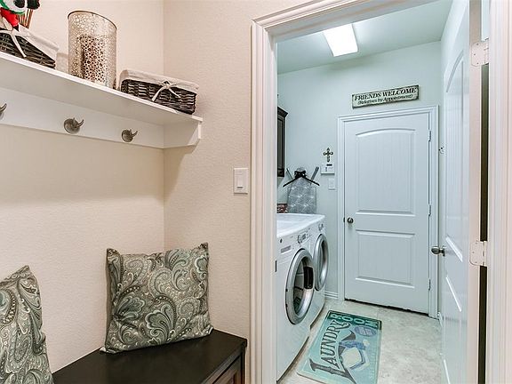 Through the mud room you will find the large laundry (notice the added raised panel poplar style upper cabinets) leading in to the 2 car garage with an extension large enough to easily fit a deep freeze or secondary refrigerator.