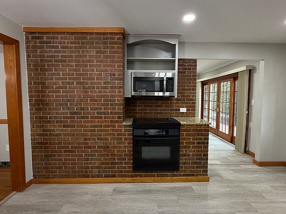 Cozy Brick Accent Wall in Kitchen