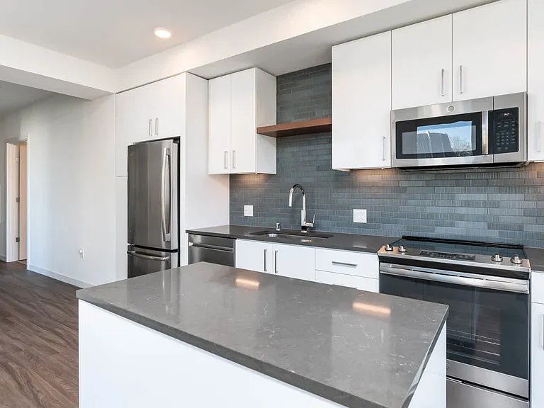 Kitchen with Quartz Countertops and Stainless Steel Appliances