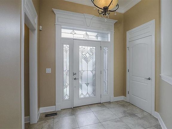 ATTRACTIVE PELLA LEADED GLASS WINDOWS AND DOOR IN ENTRY