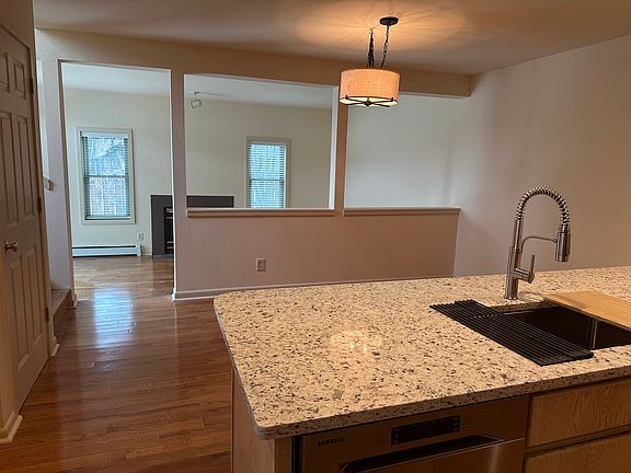 Kitchen counter looking into the Dining Room and Living Room beyond