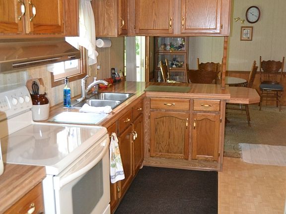 The kitchen is a great work space.  It has Oak cabinets that have ample storage space and plenty of counter space for making large meals.
