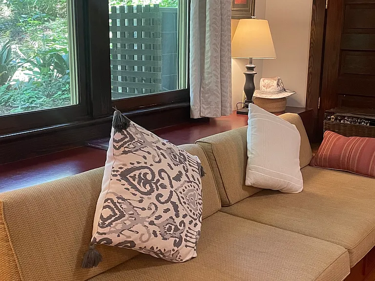 Large windows with views of the garden.