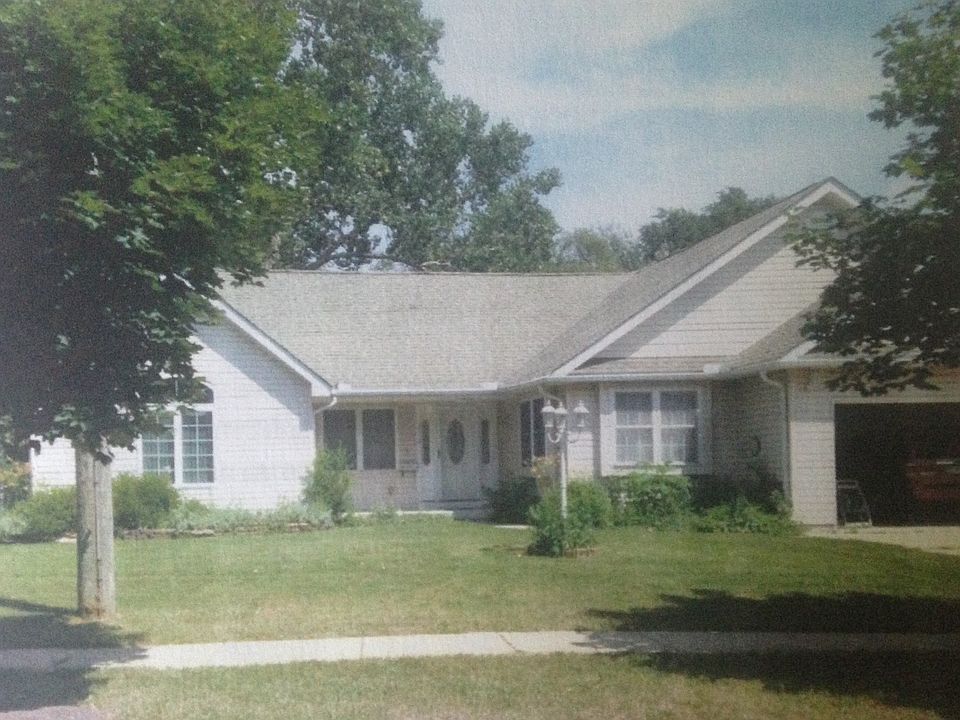 Front of House With Two car.