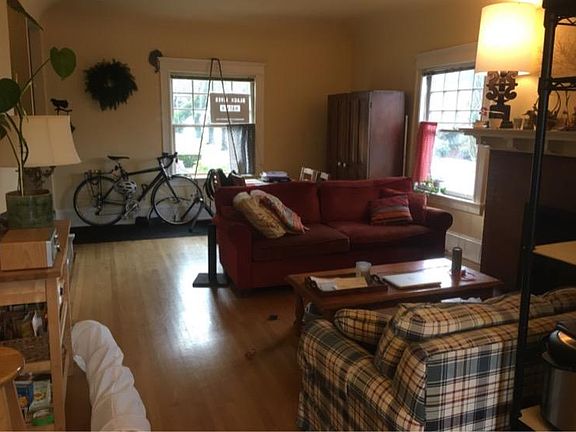 Expansive great room, with bright south facing windows and wood burning fireplace.