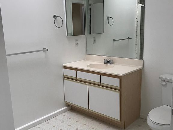 Spacious Guest Bathroom with standing shower and pantry stor
