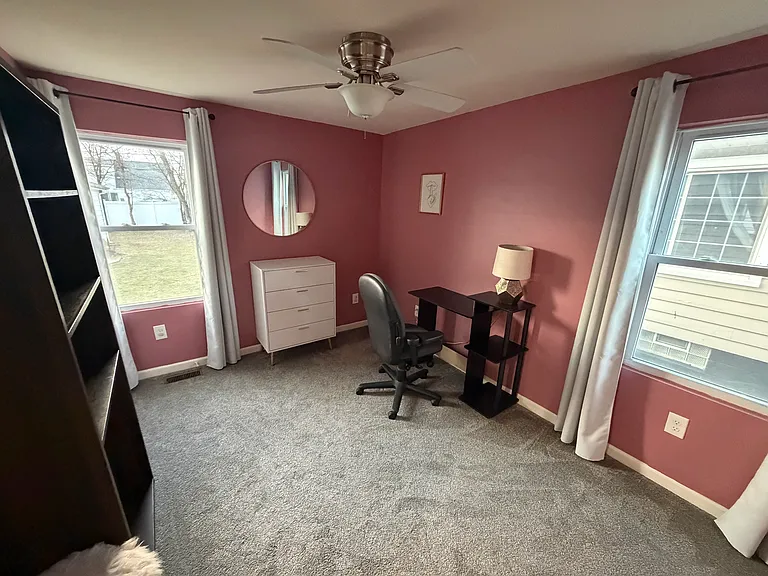 Downstairs bedroom without bed - desk and chair are no longer in this room.