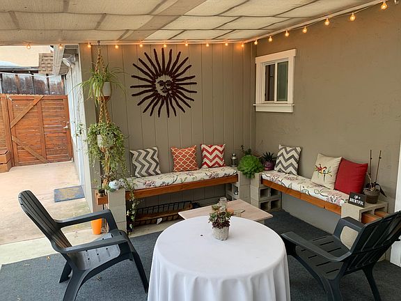 Pretty covered patio with custom built benches for a relaxing evening.