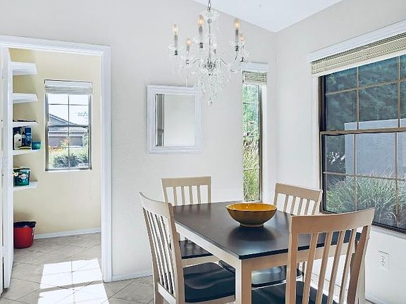 Bright eat in breakfast area and conveniently located separate laundry room.