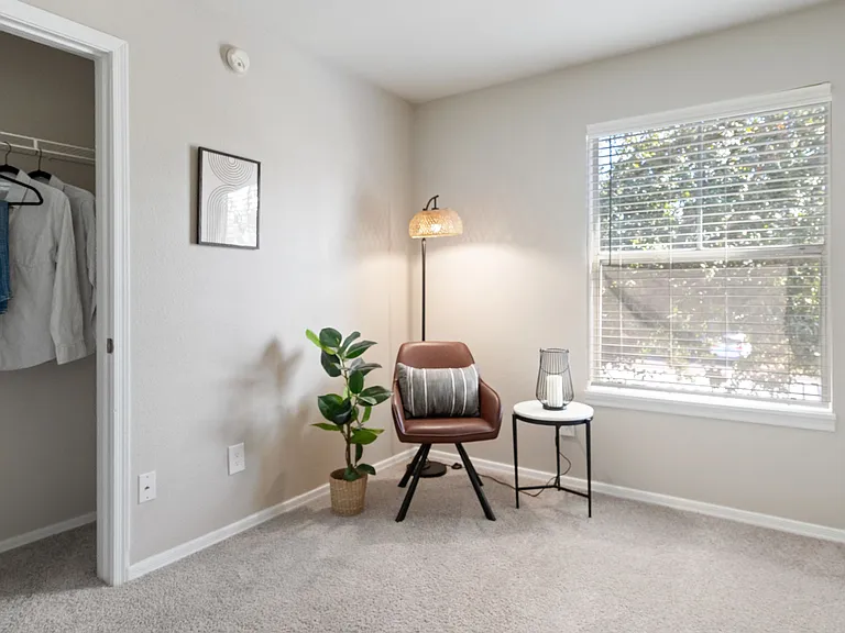 Create your perfect space in this serene and stylish bedroom with plush carpeting, a spacious closet, and a large window for natural light.