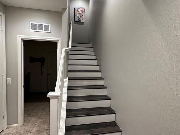 front door to upper mid level stair case