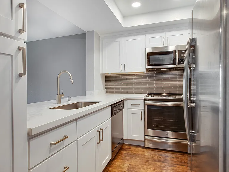 Kitchen complete with breakfast bar and pantry