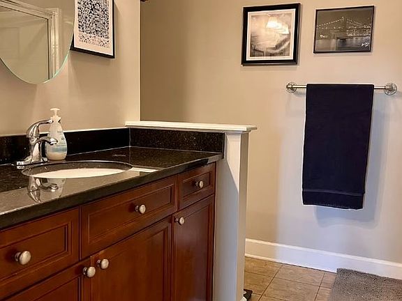 Master Bathroom with Garden Tub/Shower. Tile floors and granite countertops