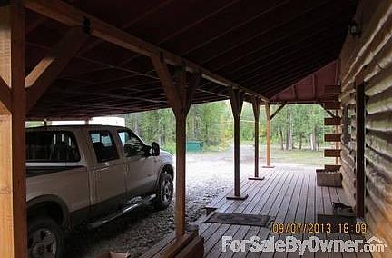 ATTACHED CARPORT
						:
						Entering into the kitchen area.