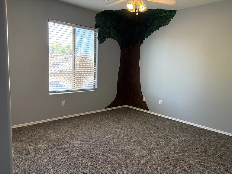 Bed room with a tree