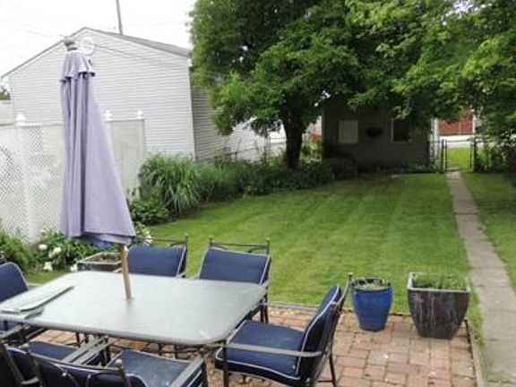 Fenced back yard with paver patio