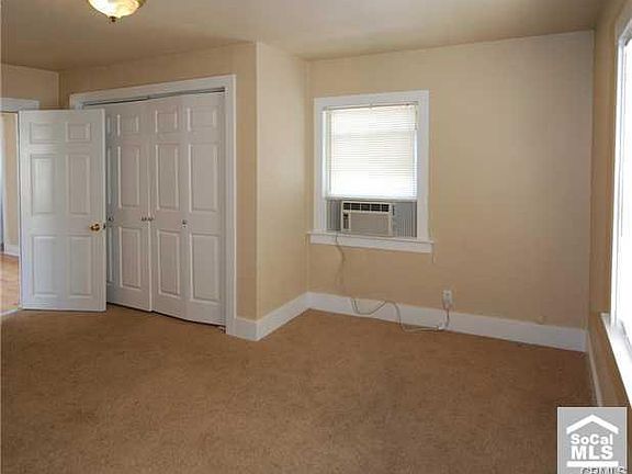 bedroom with two closets