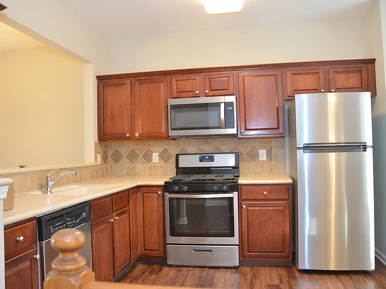 Kitchen with good cabinet storage and view to leaving room