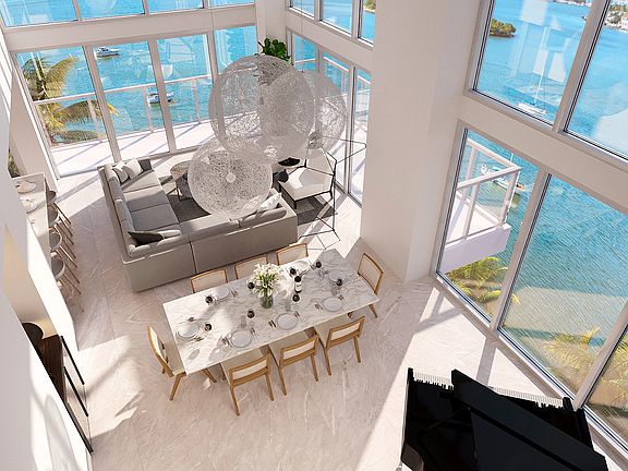 Double-height windows usher in fantastic Biscayne Bay views.