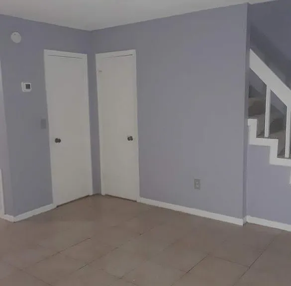 Coat Closet. 1/2 Bath under Stairs off Living Room
