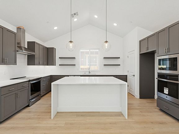 Kitchen with shaker cabinets floating shelves