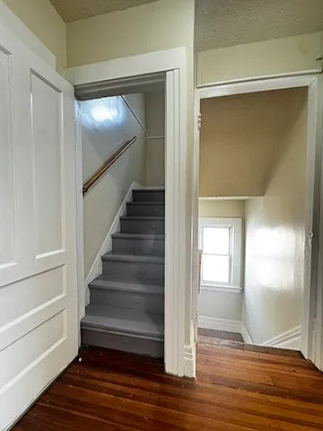 Staircase leading to the attic area, providing easy and convenient access to additional space above. Clean and functional design, connecting the main living area to a bright and airy upper level ideal for storage or flexible use.