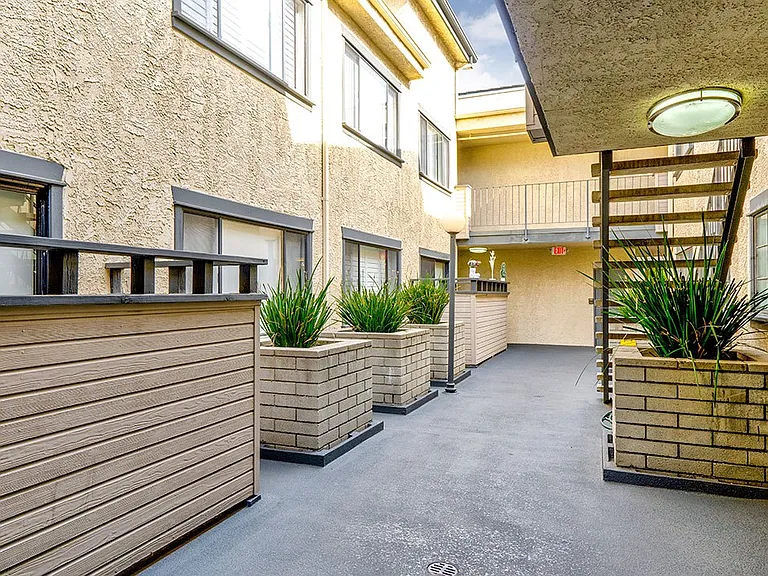 Drought-tolerant greenery and courtyard at Woodridge Apartments.