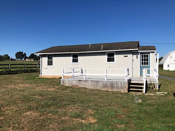 Fenced backyard and deck.