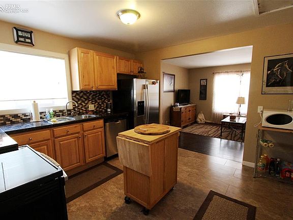Ceramic tile floors and counters. Tile backsplash, newer cabinets and a sweet li