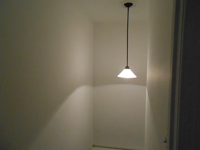 lighting in the hallway leading to basement