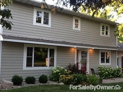 Beautifully maintained and unique two story home with maintenance free siding