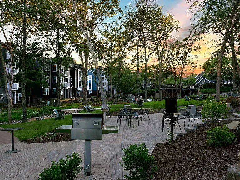 Courtyards nestled throughout the community feature grills and lounge seating