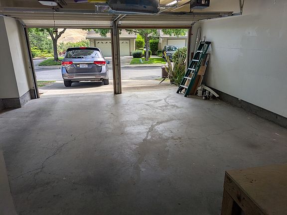 garage with two outdoor parking spaces