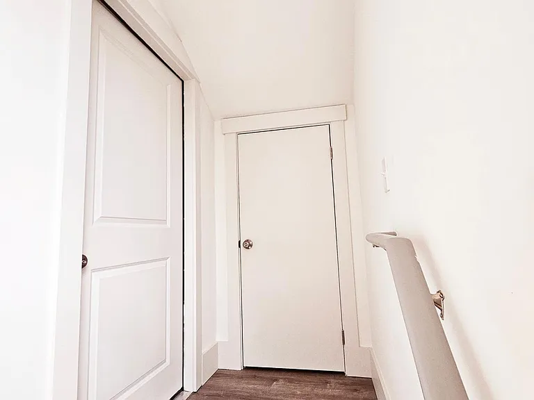 Upstairs landing closet with locked storage.