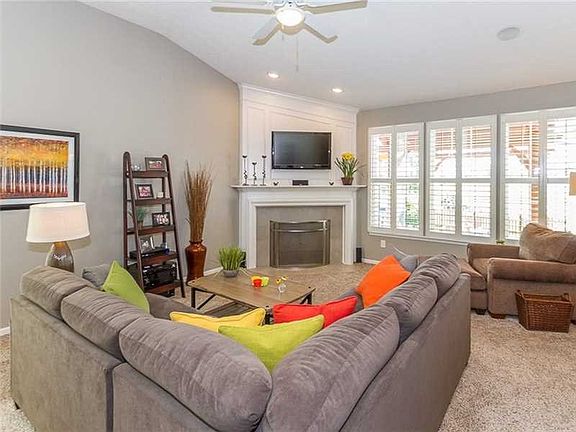 Great Room. with new tiling around the gas fireplace, new carpet