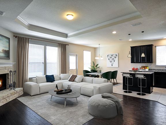 Model Representation - Spacious gathering room with optional fireplace