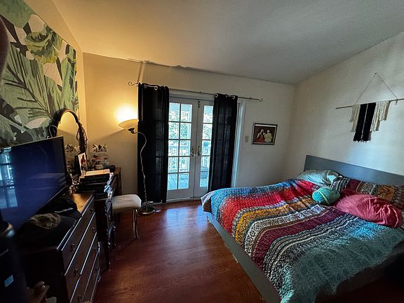 Bedroom with deck beyond.
