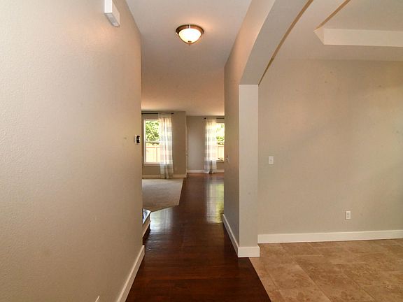 main floor hallway to kitchen, formal dinner room at left side of hallway